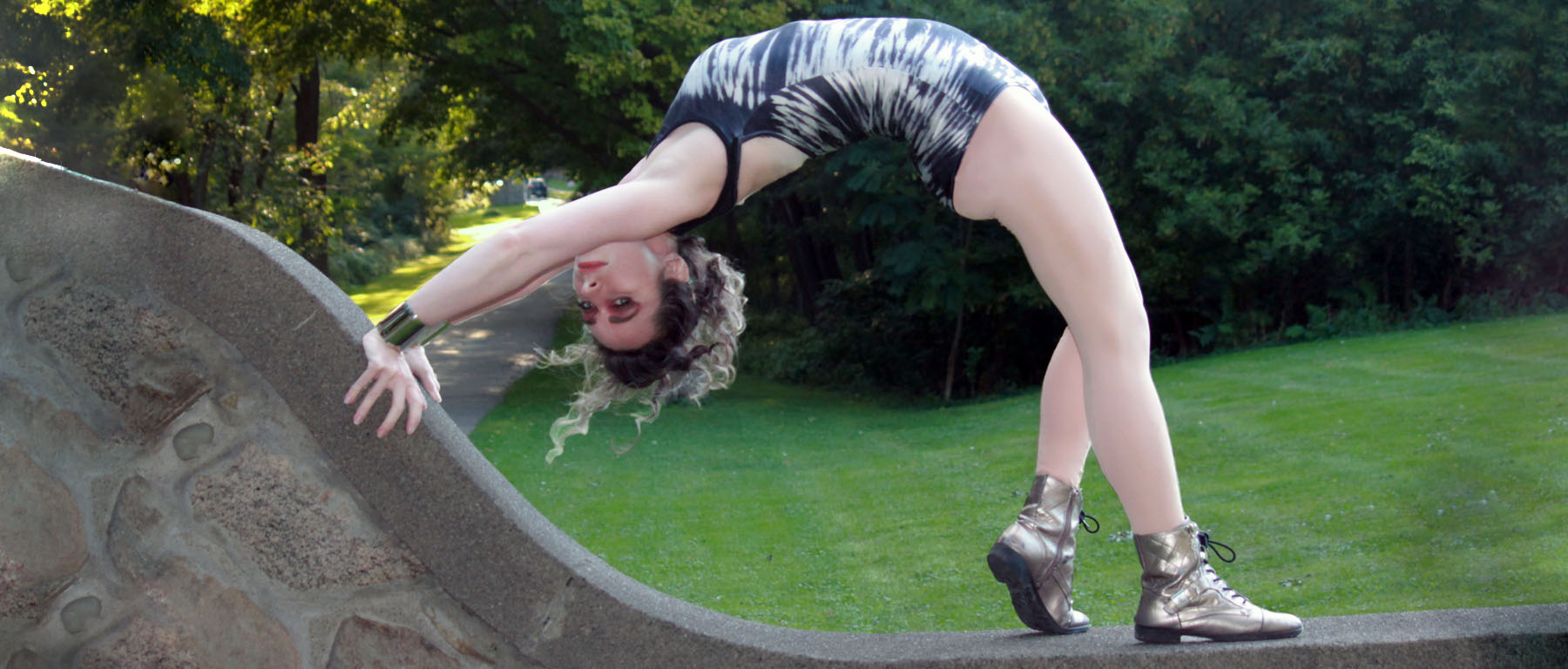 Woman in a leotard doing a backbend